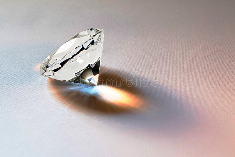 Faceted diamond gemstone with brilliant internal refraction to be mounted in jewelry or bought as a loose stone for investment on a white background. Faceted diamond gemstone with brilliant internal refraction to be mounted in jewelry or bought as a loose stone for investment on a white background