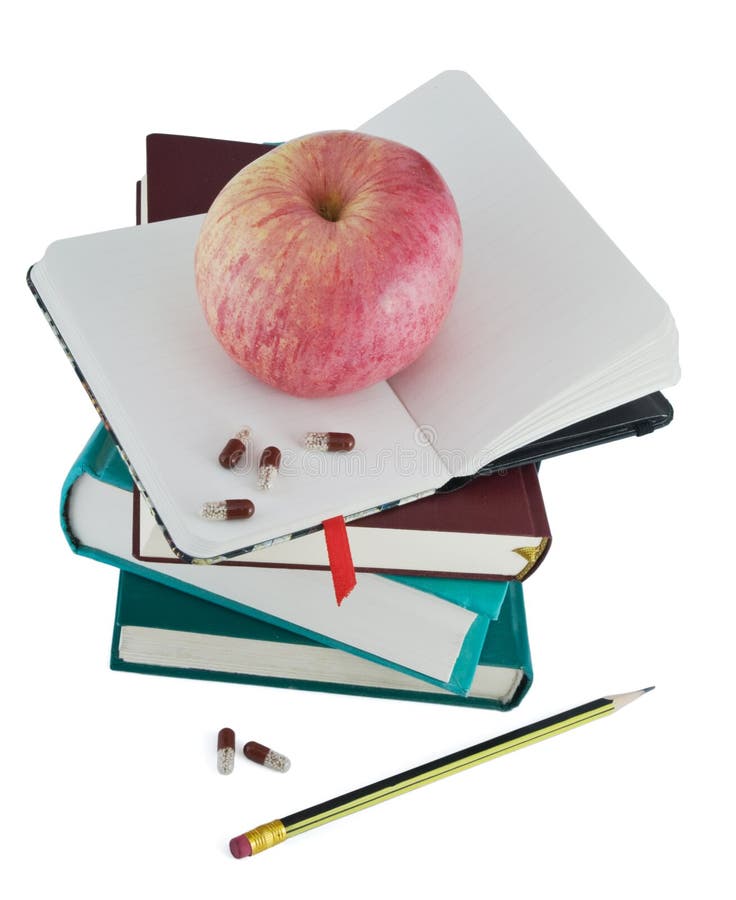 Diary with apple and pills for effective dieting