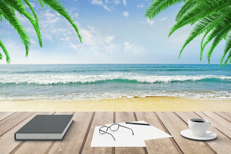 Diary, blank papers and cup of coffee on wooden bench at beach b