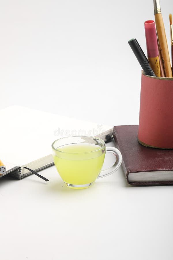 Diary and Pen with Cup of Green Tea. Work from Home Concept Stock Image