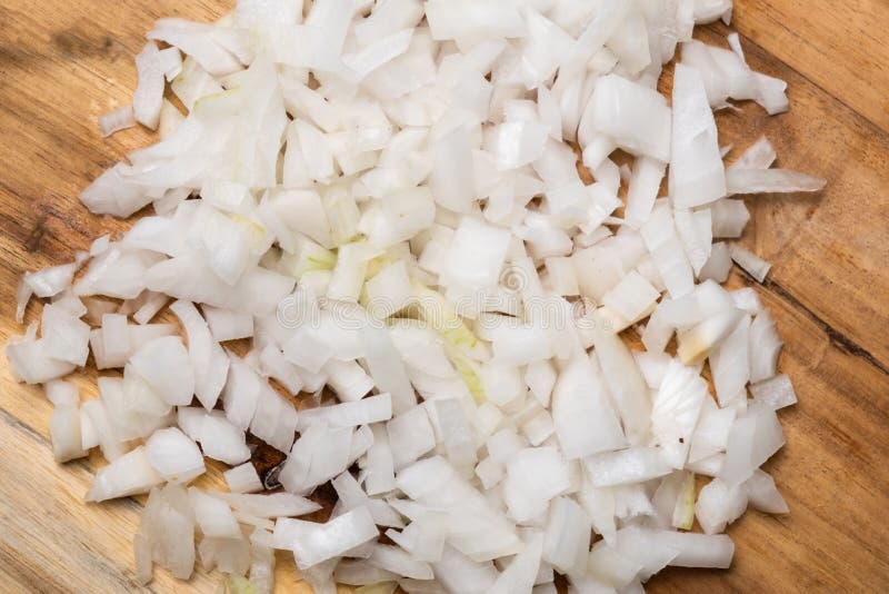 Diced Onion on a Wooden Cutting Board. Sliced White Onion Stock Image
