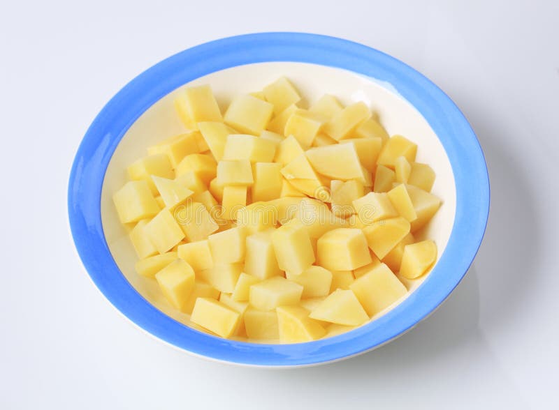 Boiled Diced Potatoes in an Aluminum Pan in the Kitchen Stock Image