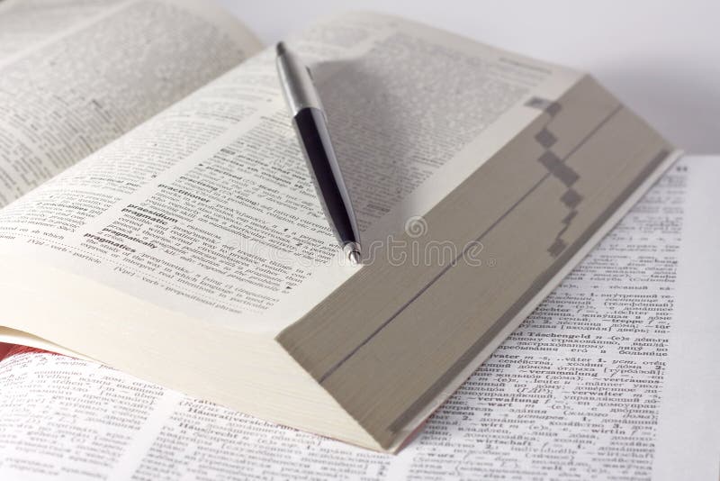 Dictionary with a pen stock image. Image of notebook 11984009