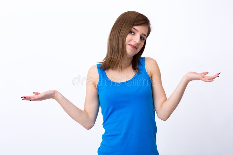 Portrait of a young woman gesturing to say I don't know. Portrait of a young woman gesturing to say I don't know