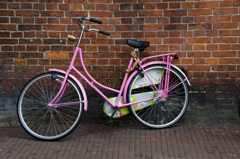 Iconic commuter bicycles old building amsterdam holland the netherlands. Iconic commuter bicycles old building amsterdam holland the netherlands