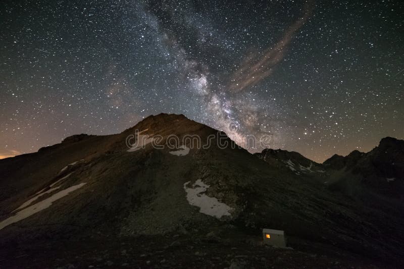 The Milky Way over the mountains, long exposure taken at 2500 m in the italian-french Alps. High iso: digital noise, grainy. The Milky Way over the mountains, long exposure taken at 2500 m in the italian-french Alps. High iso: digital noise, grainy.