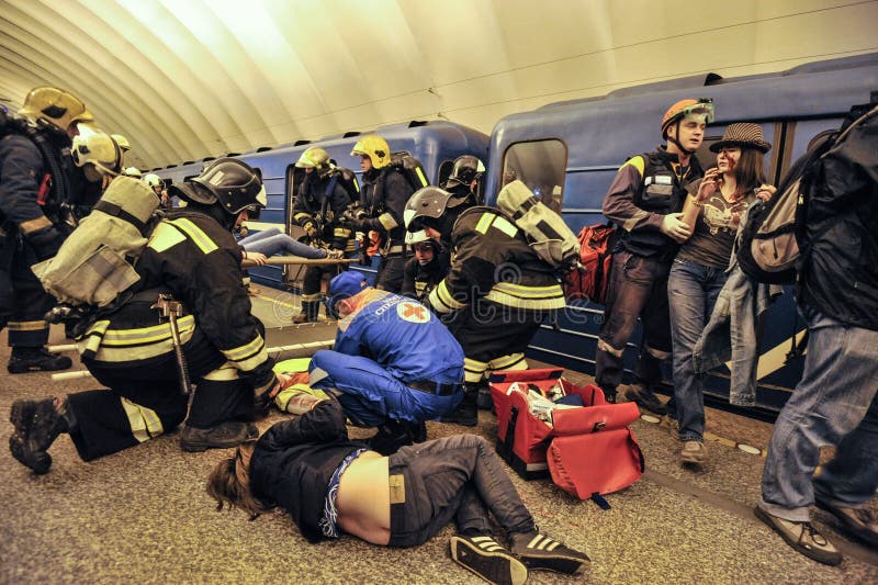 Saint-Petersburg, Russia - August 12, 2016: Integrated special tactical exercises in the aftermath of the subway. Employees of Ministry of Emergency Situations rescue the victims of the incident. Saint-Petersburg, Russia - August 12, 2016: Integrated special tactical exercises in the aftermath of the subway. Employees of Ministry of Emergency Situations rescue the victims of the incident.