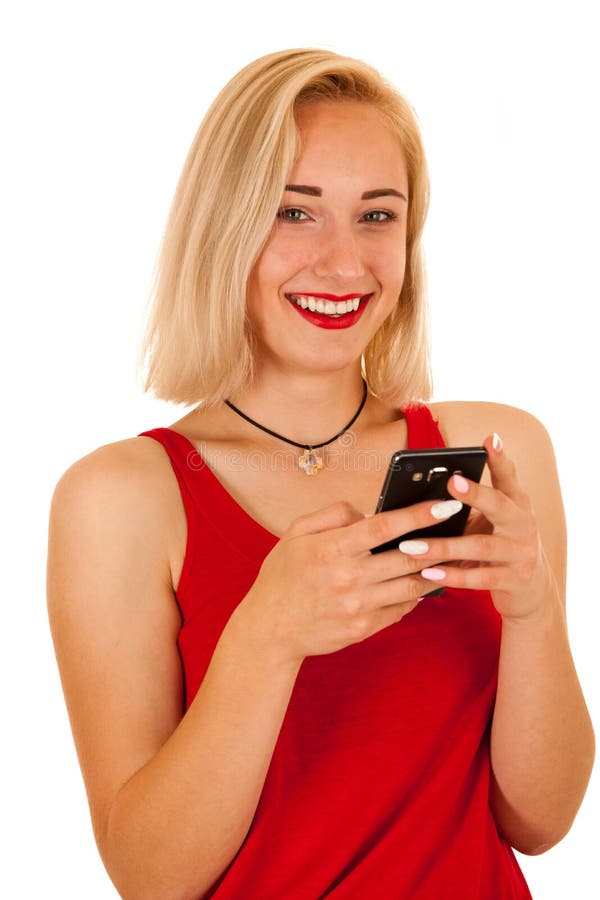 Die schöne blonde Jugendliche, die am intelligenten Telefon simst, lokalisierte ov lizenzfreie stockbilder Die schöne blonde Jugendliche, die am intelligenten Telefon simst, lokalisierte ov lizenzfreie stockbilder