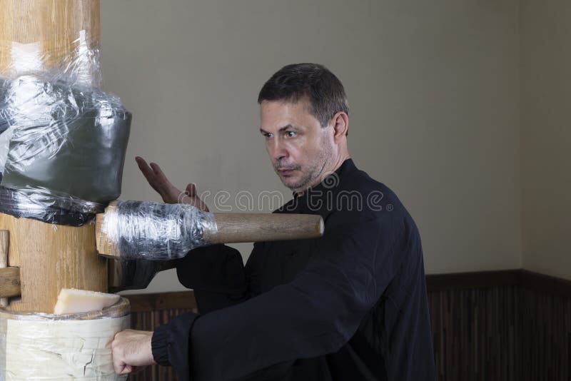 Working out the technique of striking a makivare. Close-up. Working out the technique of striking a makivare. Close-up