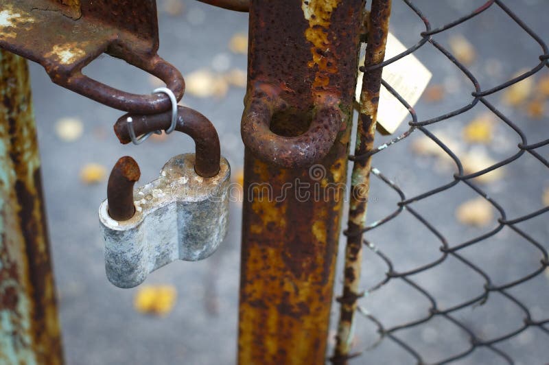 Rusted broken lock on the gates. Rusted broken lock on the gates