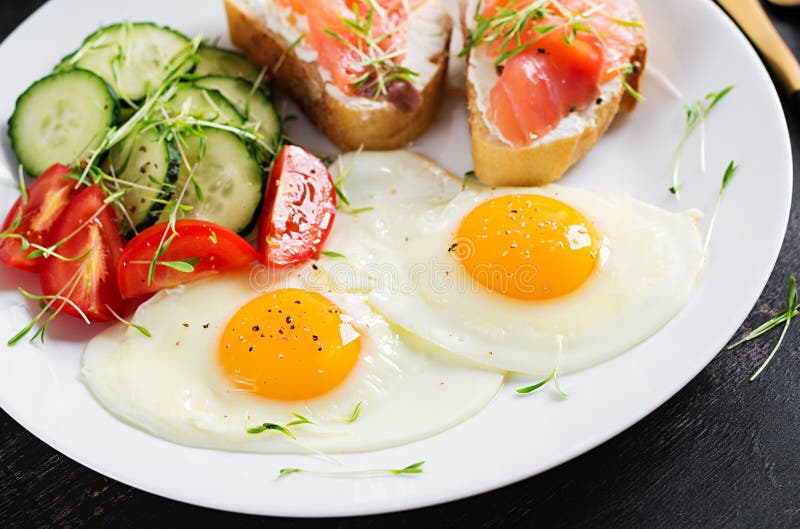 Diet Breakfast. Fried Eggs and Sandwiches with Salt Salmon Stock Image