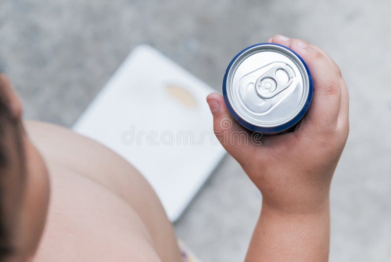 Diet. fat boy holding soft drink can.