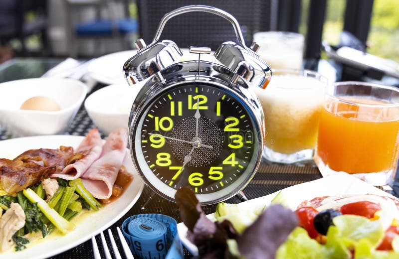 Diet Plan with Alarm Clock As Interval Fasting Healthy Diet Concept