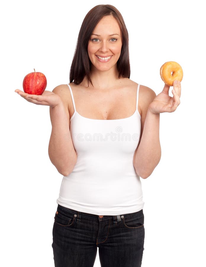 Diet woman holding an apple and a donut