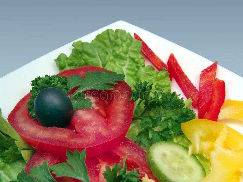 Dietic salad with olive in white plate royalty free stock photos Dietic salad with olive in white plate royalty free stock photos