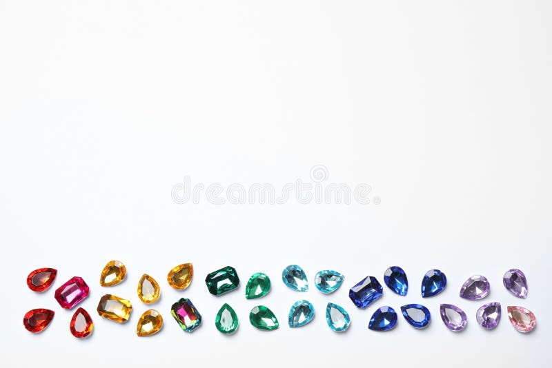 Different beautiful gemstones on white background stock photos