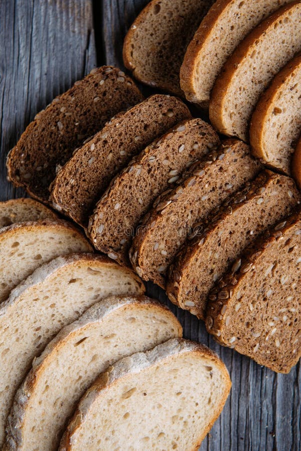 Different Bread Slices on Wooden Table, Pastries Combination, Rye Bread