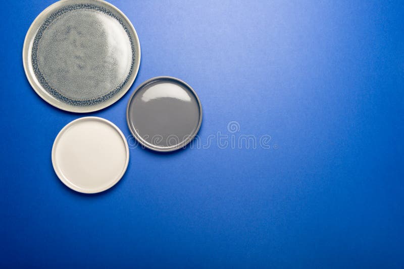 Empty Blue Plates on Grey Background Stock Image Image of table