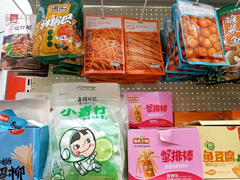 Different Chinese sweet snack packages on the display shelf in the supermarket close up stock photos Different Chinese sweet snack packages on the display shelf in the supermarket close up stock photos