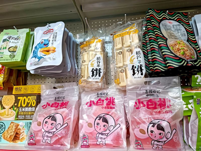 Different Chinese sweet snack packages on the display shelf in the supermarket close up stock images Different Chinese sweet snack packages on the display shelf in the supermarket close up stock images