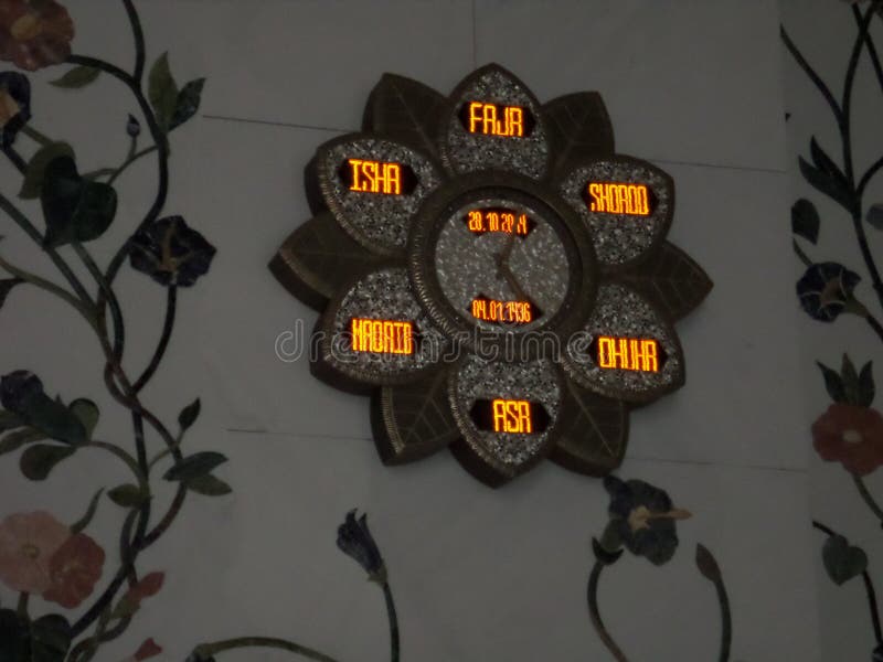 Different Clock on the Wall of the Biggest Mosque of the World
