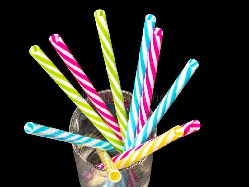 Different Colored Plastic Drinking Straws Placed In A Glass Black