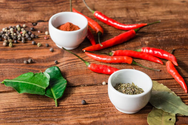Different Condiment in White Bowls or Scattered on Kitchen Table. Stock Photo Image of