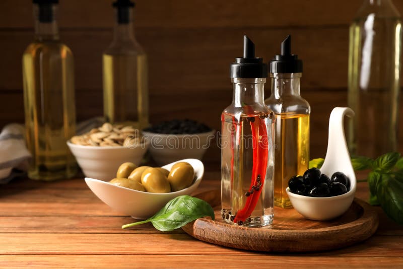Different Cooking Oils and Ingredients on Wooden Table Stock Image