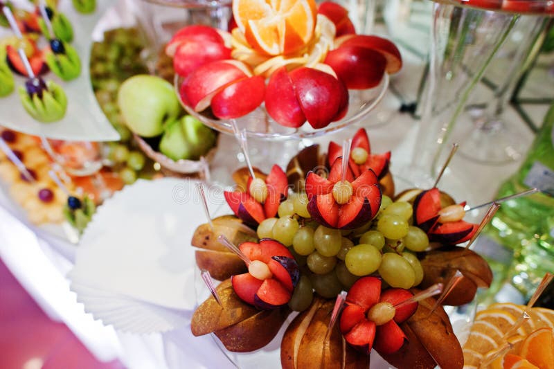 Different Delicious Fruits on Wedding Reception Table. Stock Photo