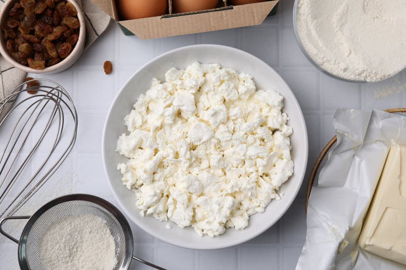 Different Ingredients on White Tiled Table, Flat Lay. Cooking Cottage