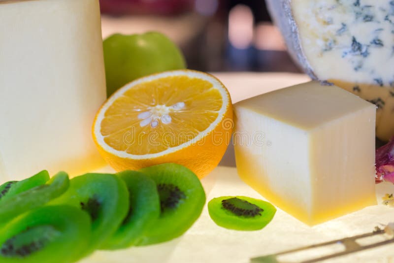 Different kinds of cheese with fresh fruits on table royalty free stock photos