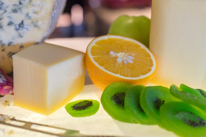 Different kinds of cheese with fresh fruits on table royalty free stock photo