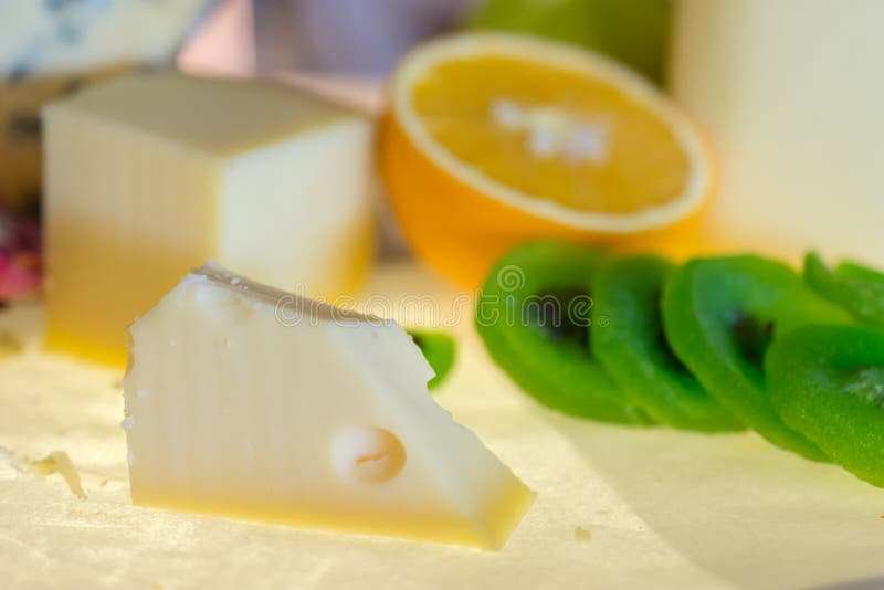 Different kinds of cheese with fresh fruits on table royalty free stock photos
