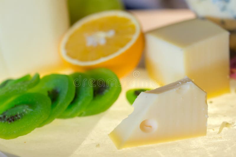Different kinds of cheese with fresh fruits on table royalty free stock photos