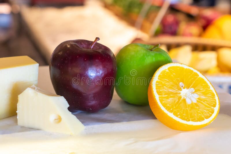 Different kinds of cheese with fresh fruits on table stock photos