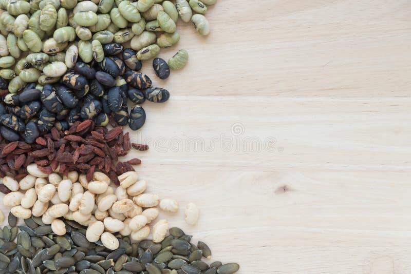 Different kinds of nuts on wooden background with copy space. stock photography Different kinds of nuts on wooden background with copy space. stock photography