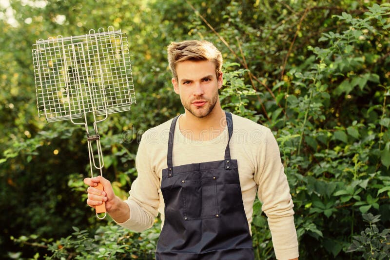 Different methods grilling beef chicken vegetables and seafood. Man hold grilling grid. Grilling food. Backyard barbeque