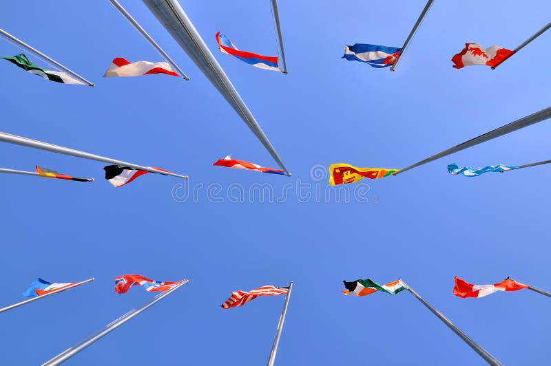 Different national flags and sky background