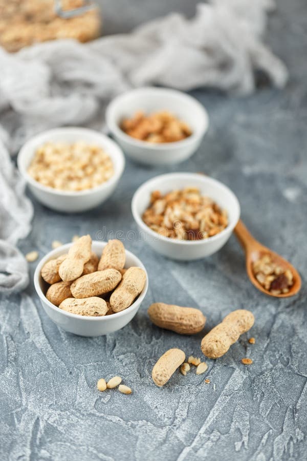 Different nuts on gray background stock photos