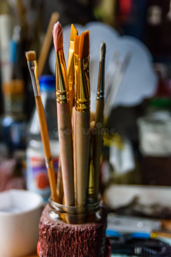 Different paint brushes in art studio