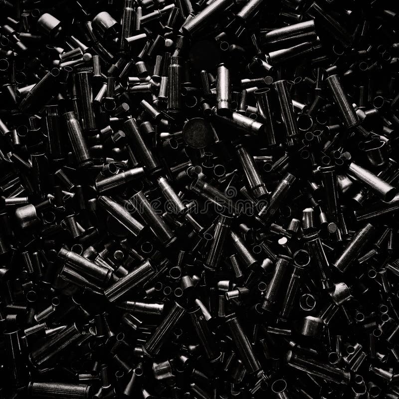 Different size bullet shells on the black ground. War concept. production of ammunition at the factory. brass bullet shell