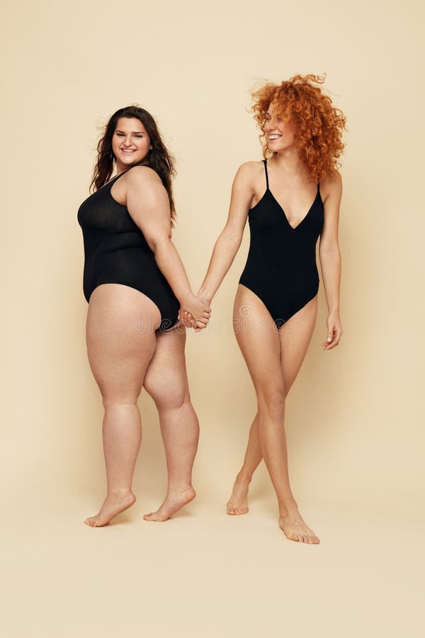 Plus Size Models. Full-figured Women in Black Bodysuits Full-length  Portrait. Brunette and Blonde Posing on Beige Background Stock Image -  Image of concept, female: 183623255