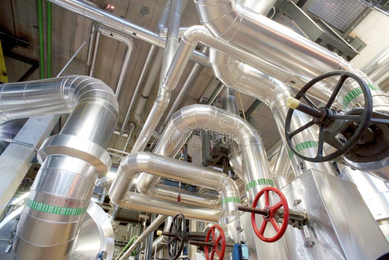 Different Size and Shaped Pipes and Valves at Power Plant Stock Photo