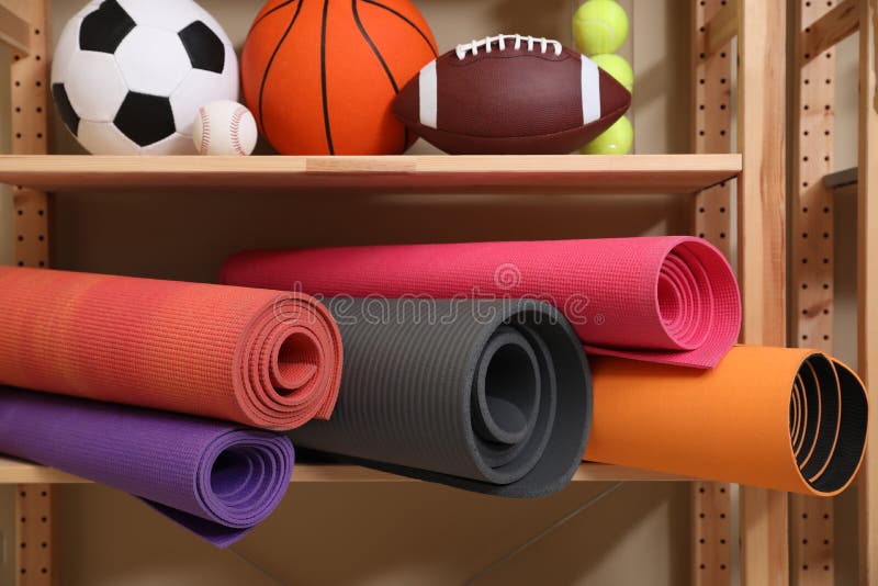 https://thumbs.dreamstime.com/b/different-sport-balls-yoga-mats-rack-indoors-different-sport-balls-yoga-mats-rack-228893598.jpg