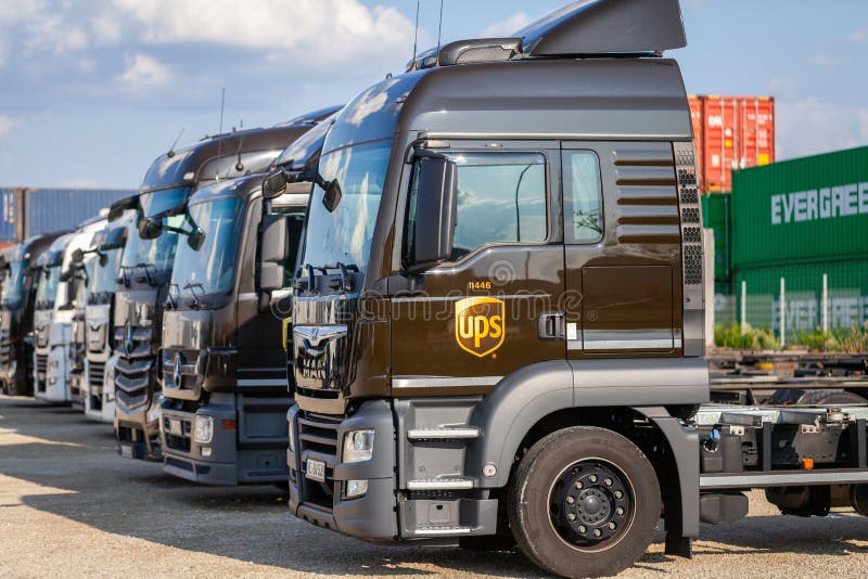 NUREMBERG / GERMANY - AUGUST 4, 2019: Different trucks from the American multinational package delivery, United Parcel Service UPS, stands near container terminal in Nuremberg