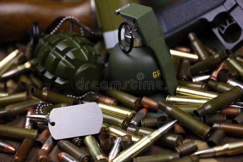 Different types of ammunition and grenades on a camouflage background. Preparing for war. Possession of weapons. Types conflict stock images, royalty-free photos and pictures