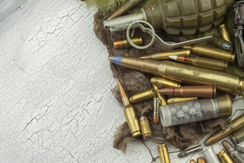 Different types of ammunition on a camouflage background. Preparing for war. Possession of weapons. Types conflict stock images, royalty-free photos and pictures