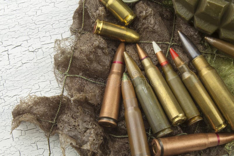 Different types of ammunition on a camouflage background. Preparing for war. Possession of weapons. Types conflict stock images, royalty-free photos and pictures