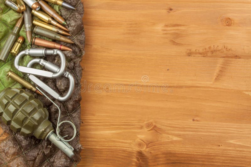 Different types of ammunition on a wooden background. Grenade and bullets. Arms trade. Types conflict stock images, royalty-free photos and pictures
