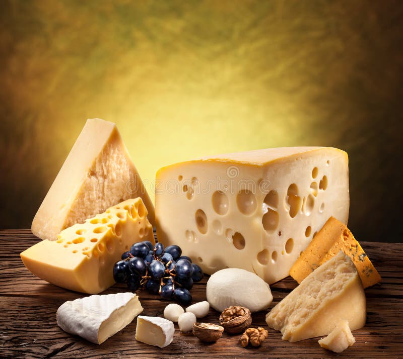 Different types of cheese on old wood. royalty free stock photography
